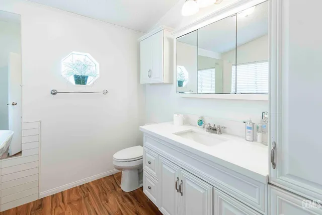 a bathroom with a sink a toilet and tub