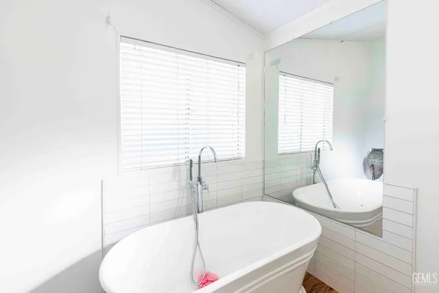 a view of a house with wooden floor and a window