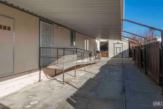 a view of a chairs and table in the patio