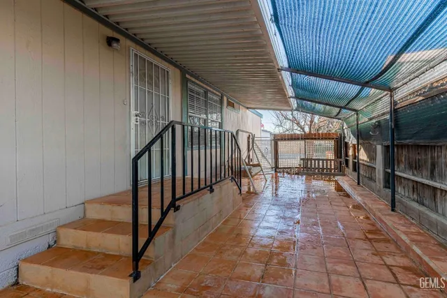a view of a porch with wooden stairs