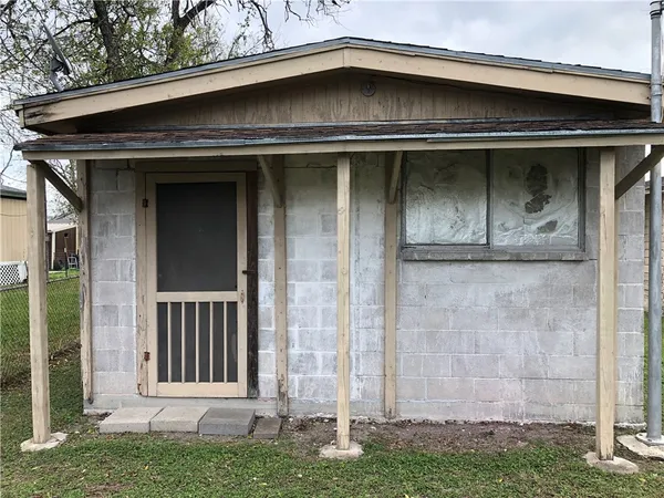 a view of a door and storage space