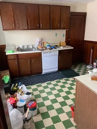 a utility room with a sink washer and dryer