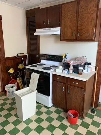 a kitchen with stainless steel appliances a stove a sink and a microwave
