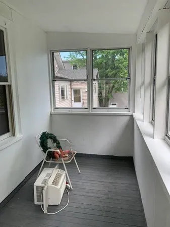a view of a living room and a wooden floor