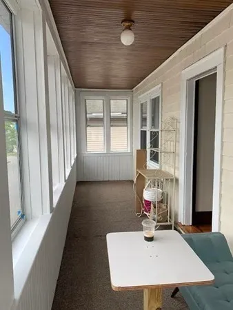 a workspace with furniture and window