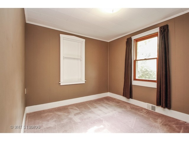 122 Eagle Point Road Fox Lake, IL 60020 - Photo 7 of 11 a view of an empty room with a window