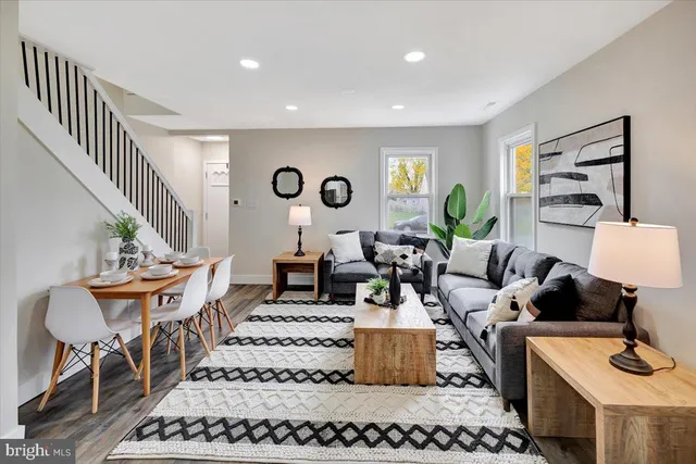 a living room with furniture and a table