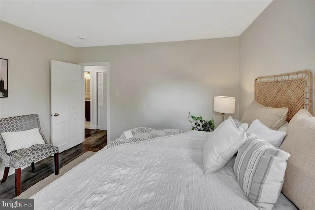 a bedroom with a bed and a couch