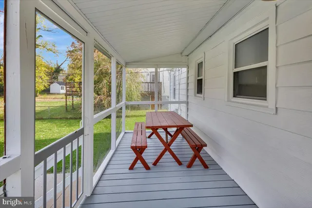 a view of a balcony with furniture