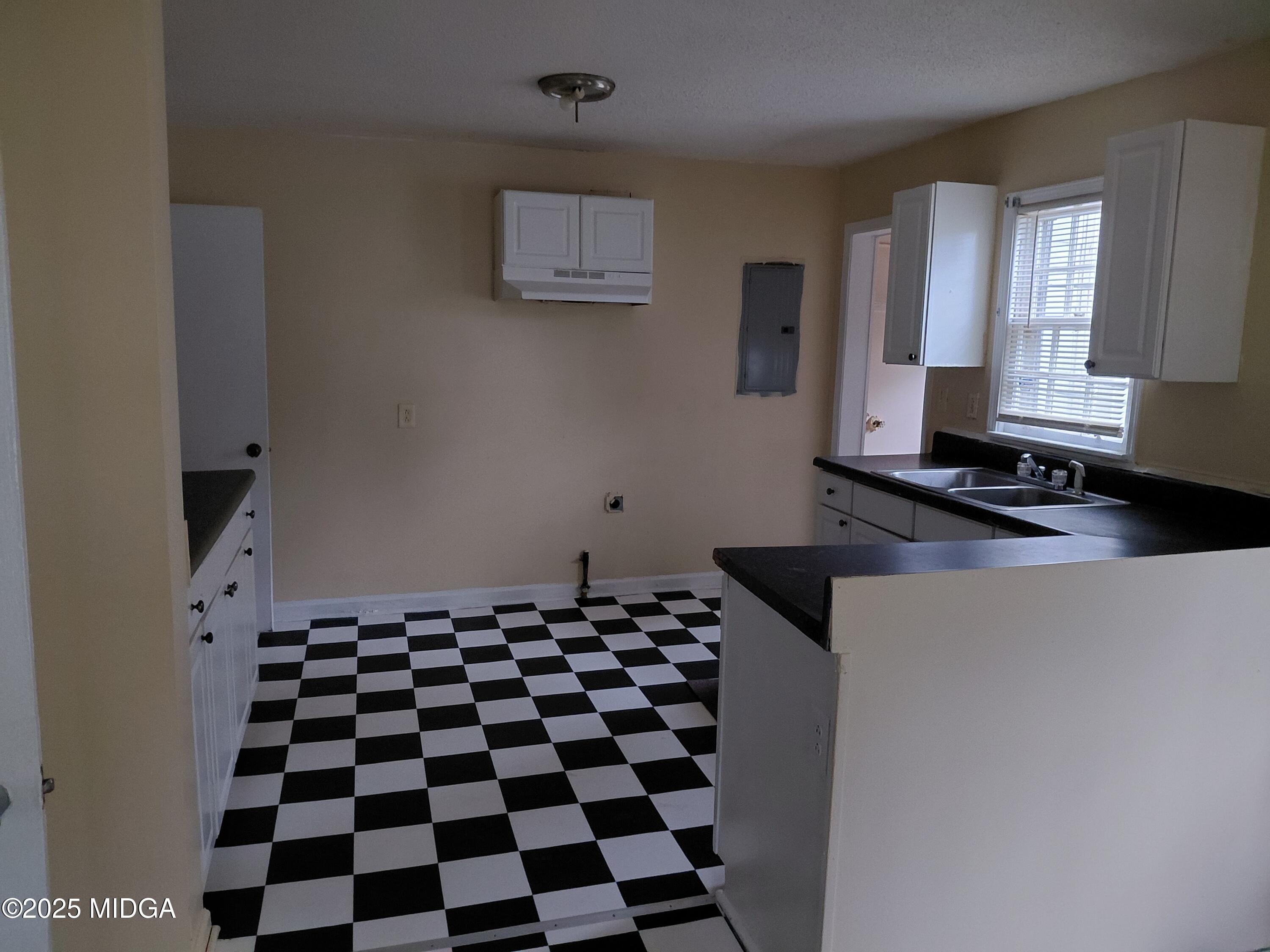 3811 Lyons Street Macon, GA 31206 - Photo 8 of 14 a black and white checkered floor with a black white checkered floor