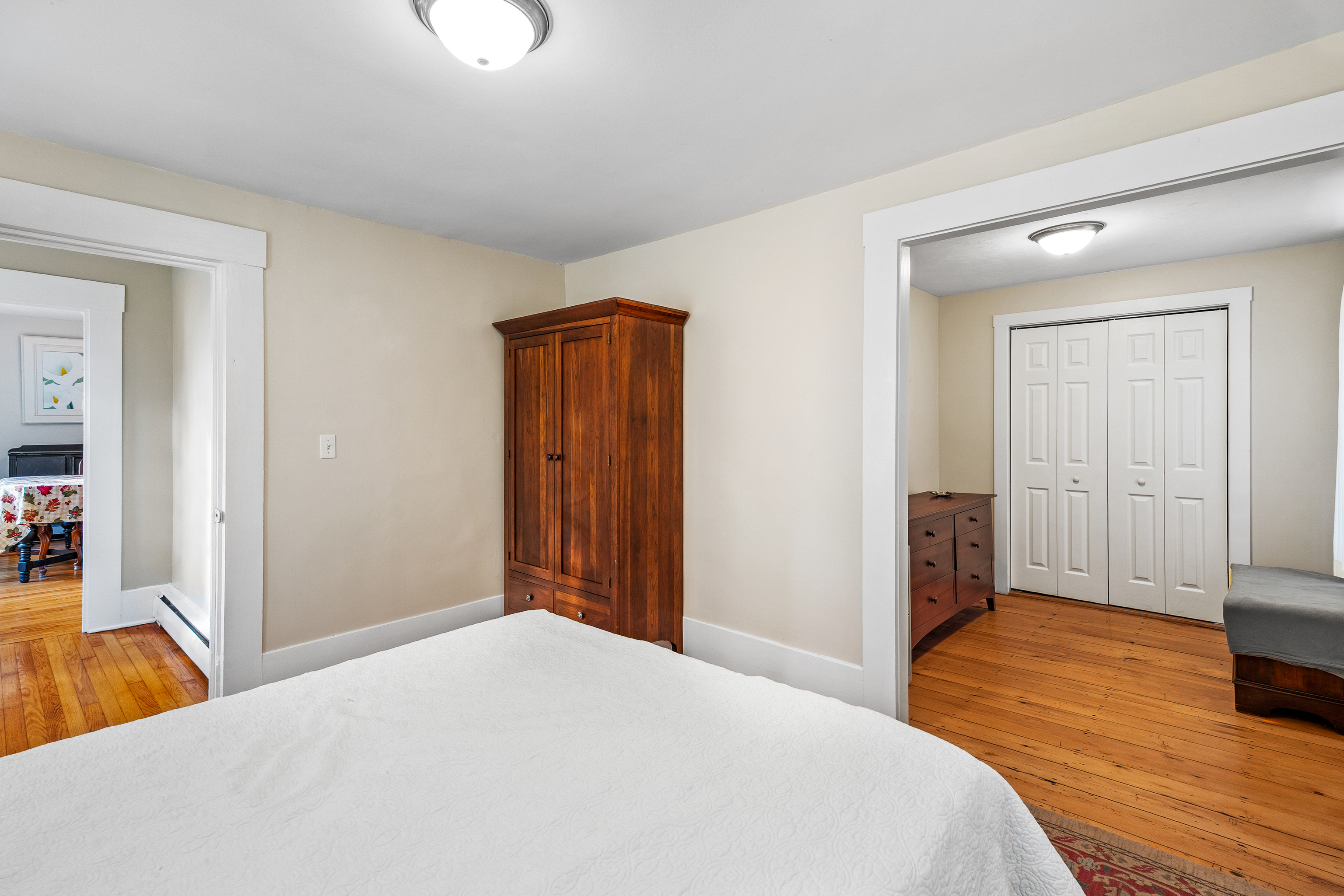 290 Providence Pike Putnam, CT 06260 - Photo 16 of 34 a bedroom with a bed and wooden floor