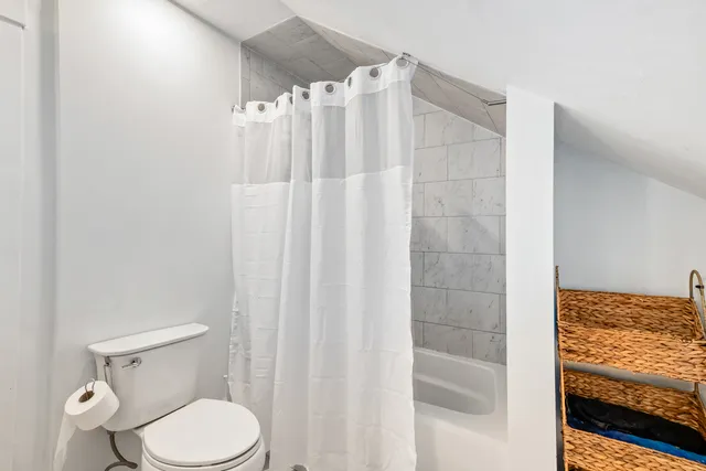 a bathroom with a shower curtain