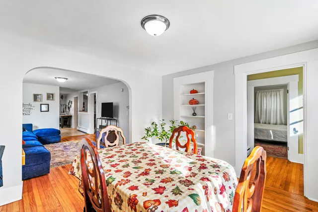a bedroom with furniture and a flat screen tv