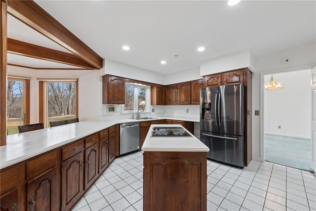64 Fox Pointe Place Pittsburgh, PA 15238 - Photo 11 of 32 a kitchen with stainless steel appliances granite countertop a refrigerator a sink and a stove