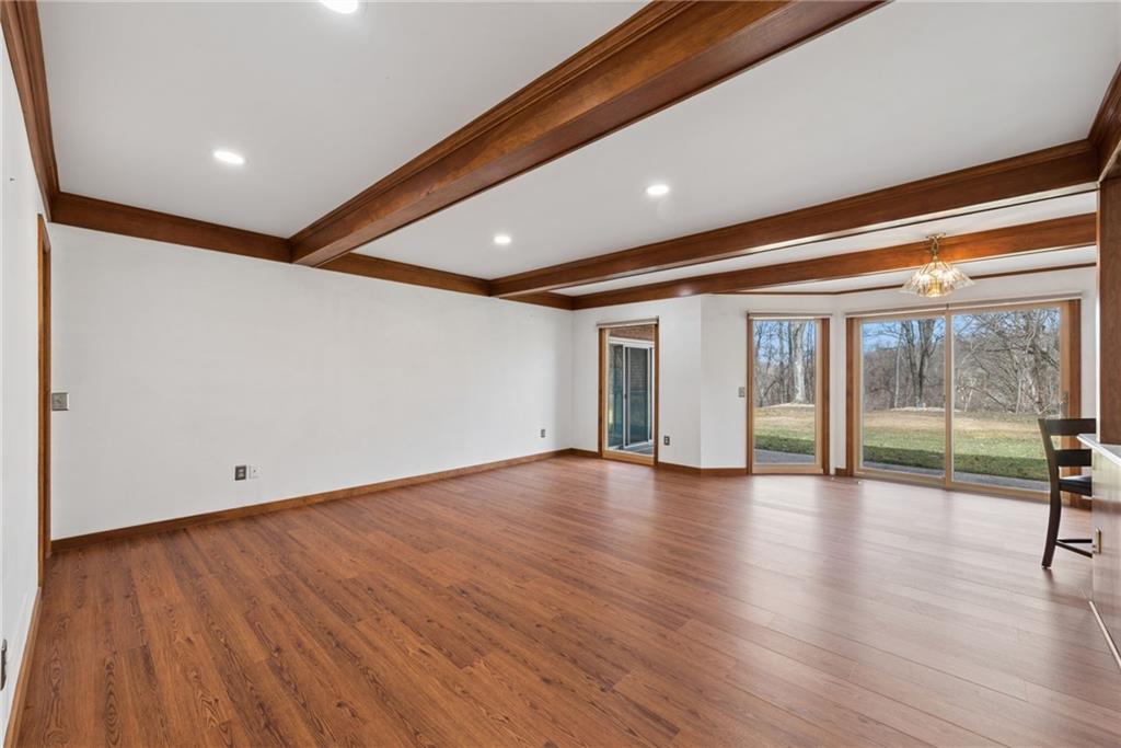 64 Fox Pointe Place Pittsburgh, PA 15238 - Photo 12 of 32 a view of empty room with wooden floor and fan