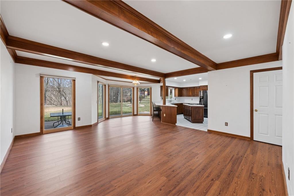 64 Fox Pointe Place Pittsburgh, PA 15238 - Photo 13 of 32 a view of an empty room with wooden floor and a window