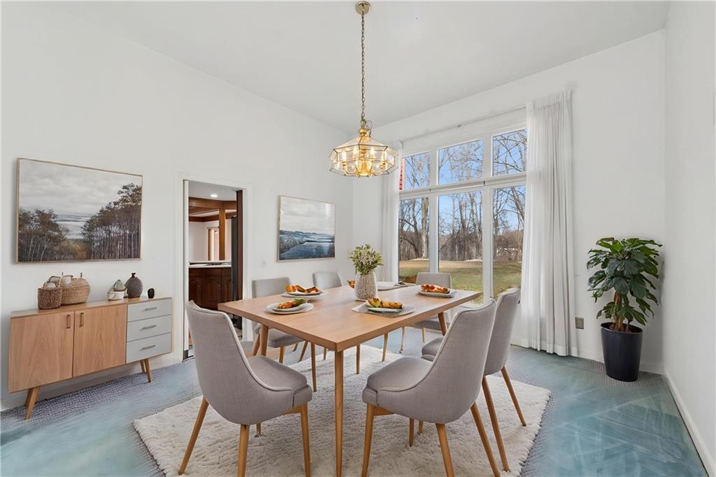 64 Fox Pointe Place Pittsburgh, PA 15238 - Photo 15 of 32 a dining room with furniture large windows and a chandelier