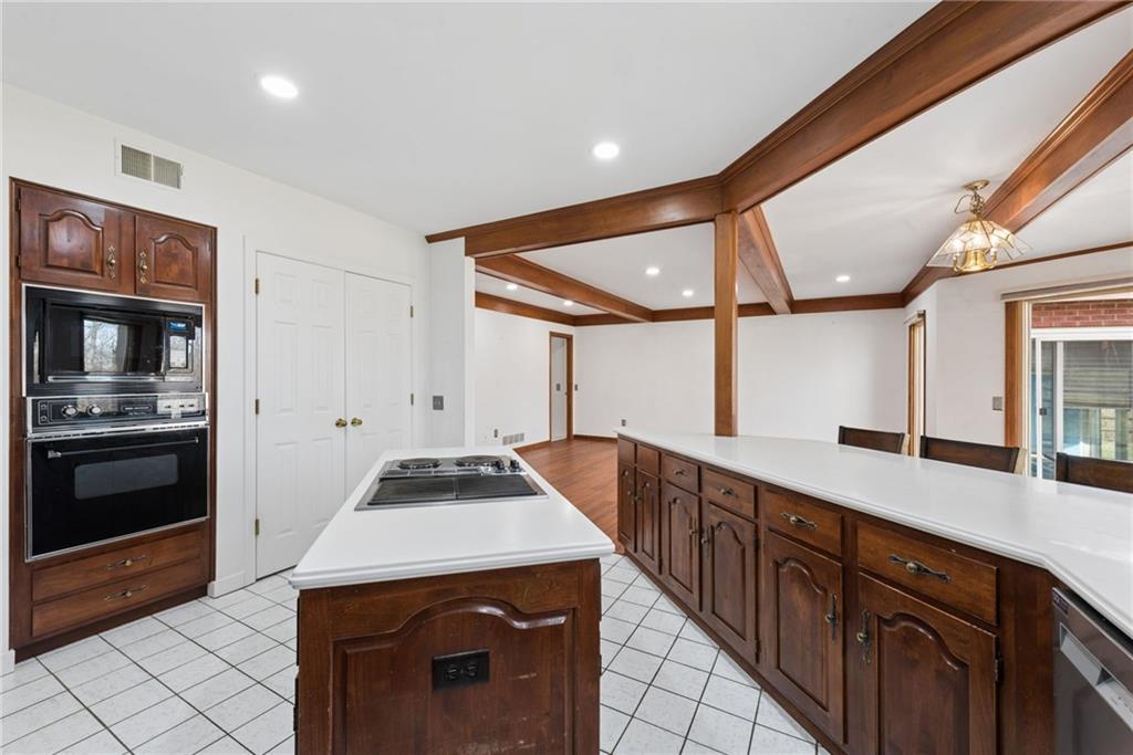 64 Fox Pointe Place Pittsburgh, PA 15238 - Photo 6 of 32 a kitchen with stainless steel appliances granite countertop a sink and cabinets