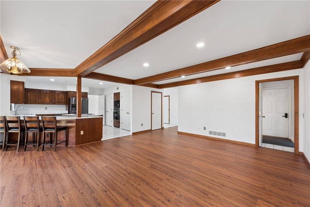 64 Fox Pointe Place Pittsburgh, PA 15238 - Photo 8 of 32 an empty room with wooden floor and furniture