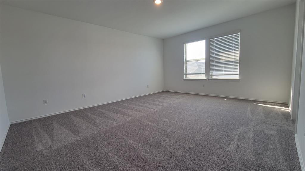 452 Pickrell Loop Georgetown, TX 78628 - Photo 13 of 19 Spare room with carpet and baseboards
