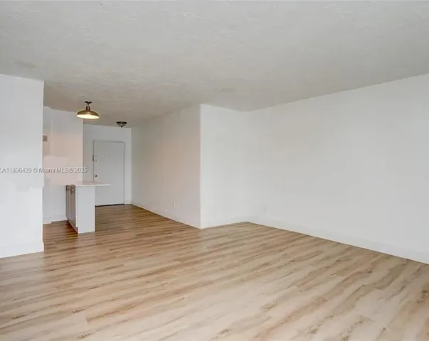 a kitchen with stainless steel appliances a refrigerator and a stove