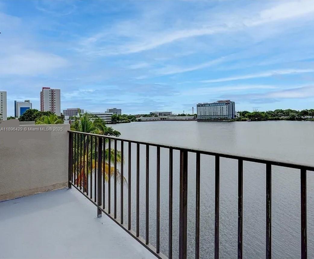 5501 Northwest 7th Street, Unit E408 Miami, FL 33126 - Photo 22 of 27 a balcony with city view