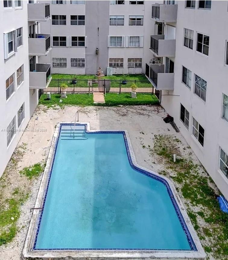 5501 Northwest 7th Street, Unit E408 Miami, FL 33126 - Photo 27 of 27 a view of building with yard