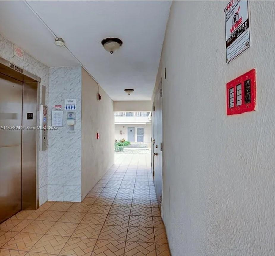 5501 Northwest 7th Street, Unit E408 Miami, FL 33126 - Photo 7 of 27 a view of a hallway
