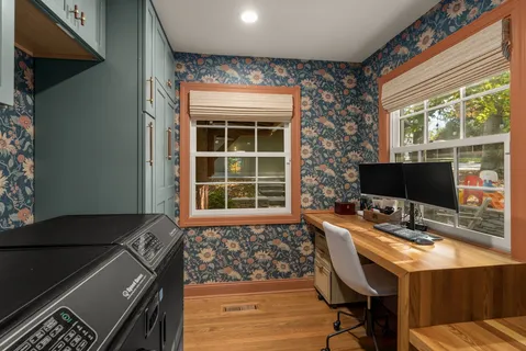 a workspace with furniture and window