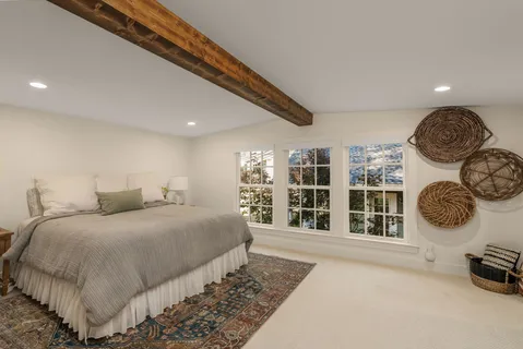 a bedroom with a bed and a walk in closet