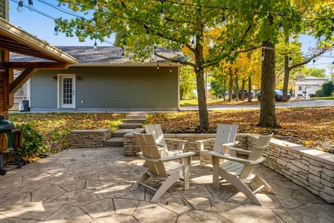 a view of a patio with table and chairs and potted plants