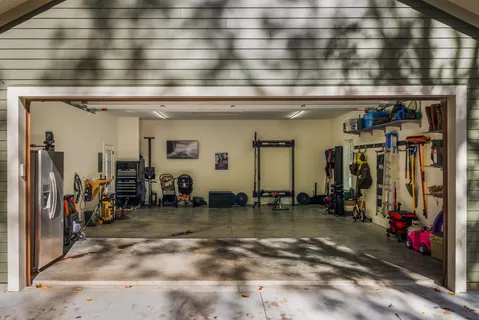 a view of a house with a yard and tree s