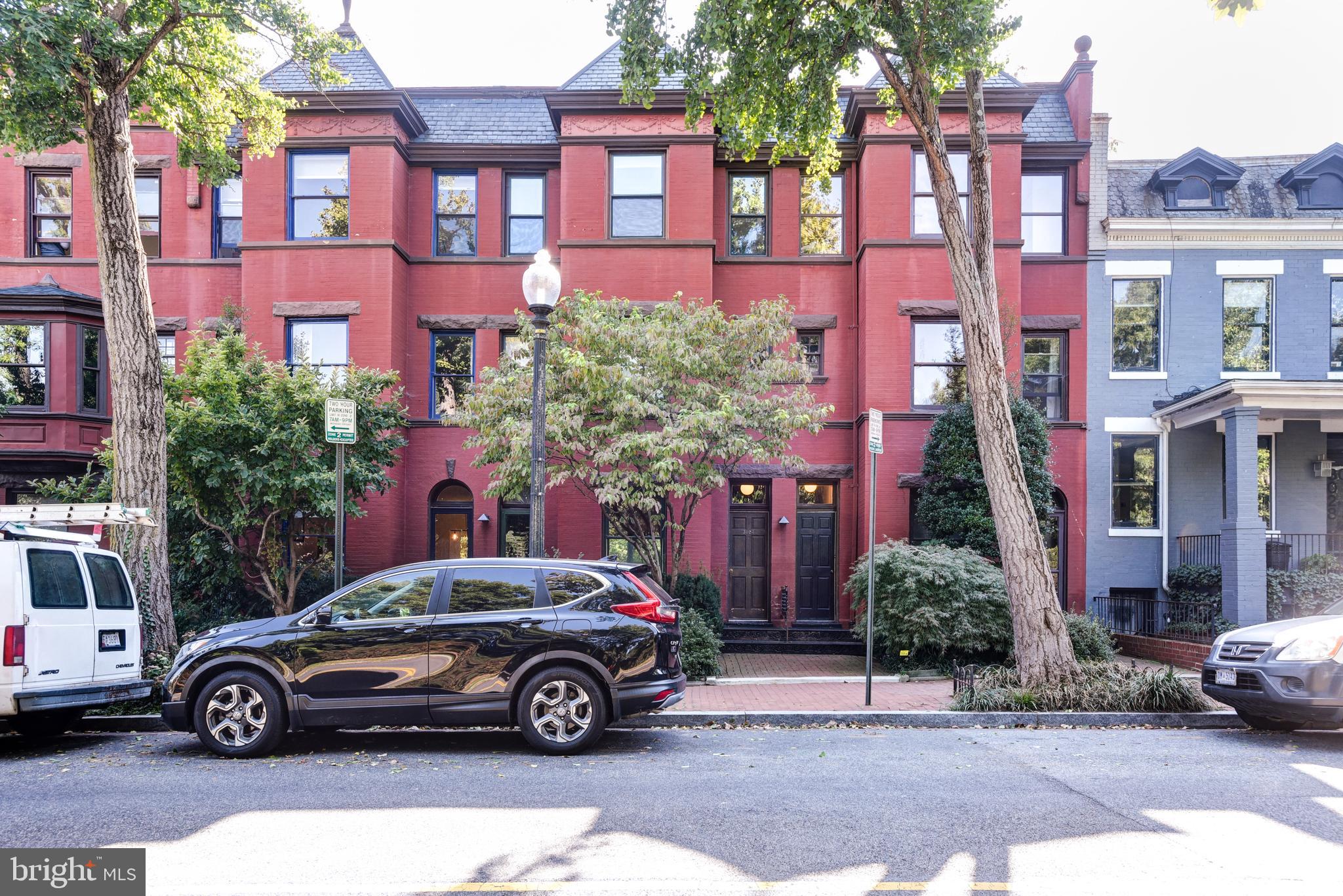 3026 R Street Northwest, Unit 2 Washington, DC 20007 - Photo 38 of 45 a car parked in front of a brick building