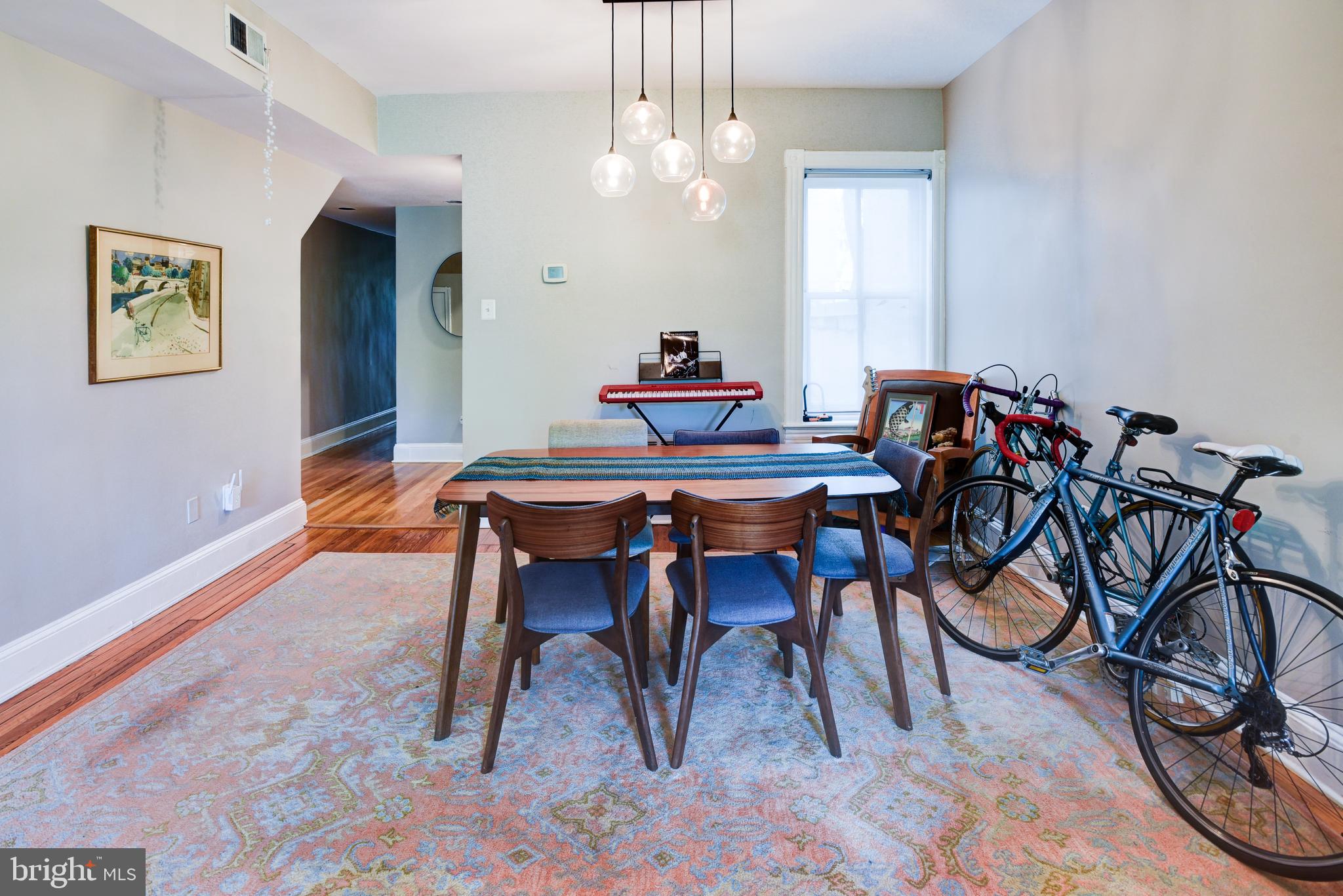 3026 R Street Northwest, Unit 2 Washington, DC 20007 - Photo 10 of 45 a view of a dining room with furniture and chandelier
