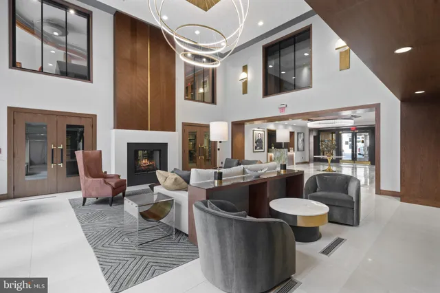 a lobby with a table and chairs