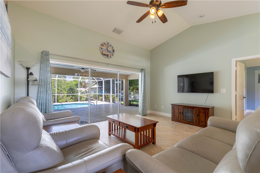 414 Ash Street Sebastian, FL 32958 - Photo 11 of 36 a living room with furniture and a flat screen tv