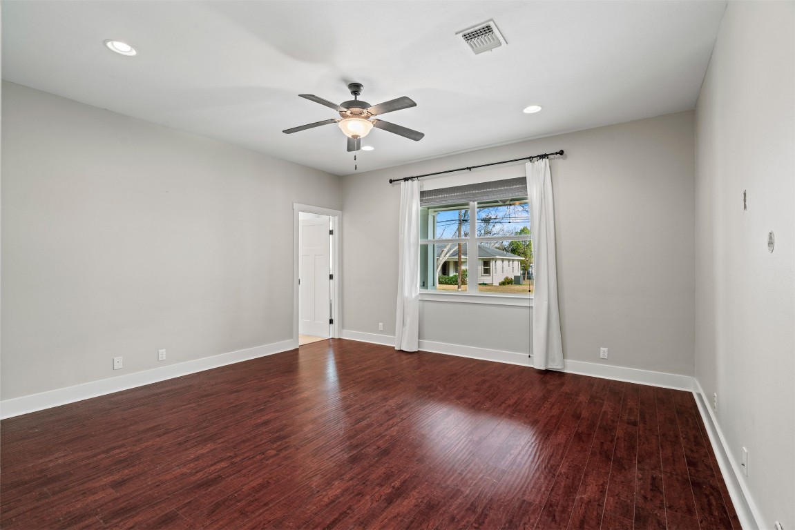 1912 South Church Street Georgetown, TX 78626 - Photo 17 of 40 a view of an empty room with wooden floor and a window