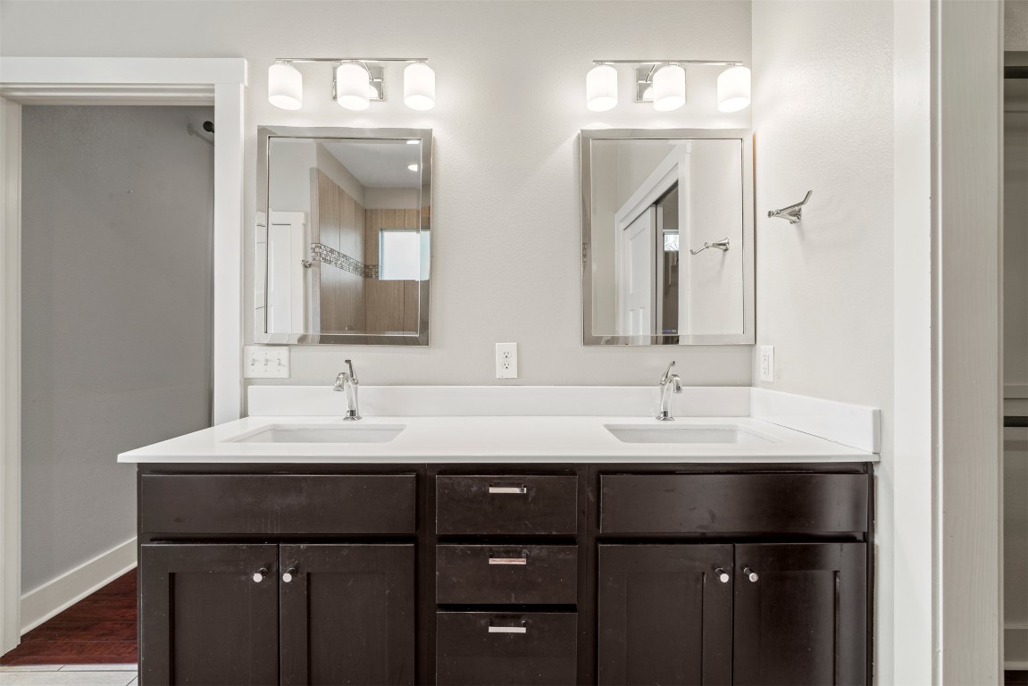 1912 South Church Street Georgetown, TX 78626 - Photo 22 of 40 a bathroom with double sink and two mirror