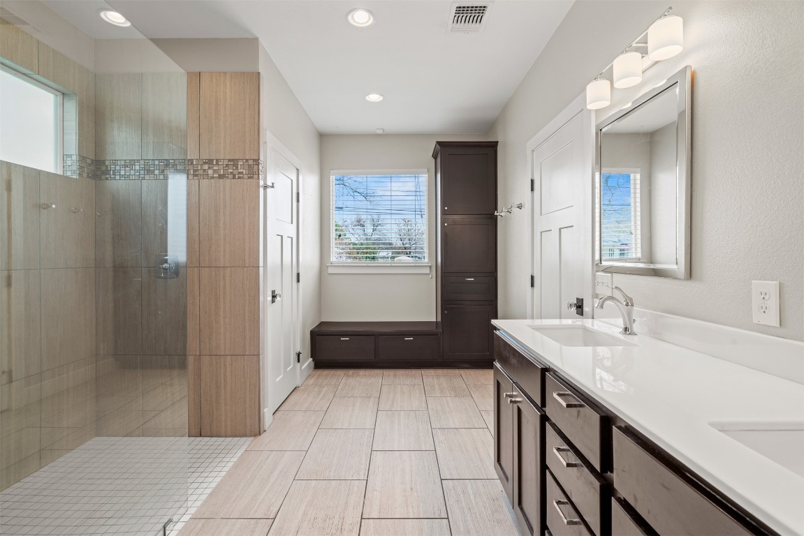 1912 South Church Street Georgetown, TX 78626 - Photo 24 of 40 a bathroom with a sink a toilet a mirror and shower