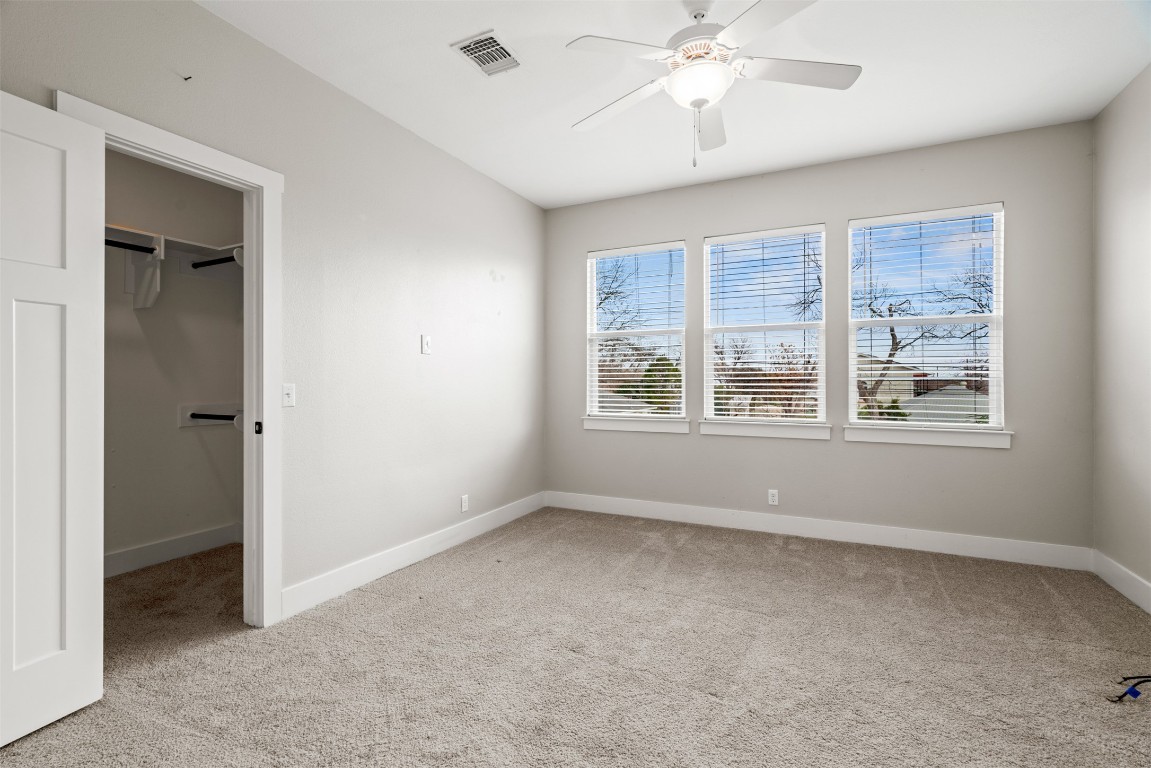 1912 South Church Street Georgetown, TX 78626 - Photo 31 of 40 an empty room with chandelier fan and windows