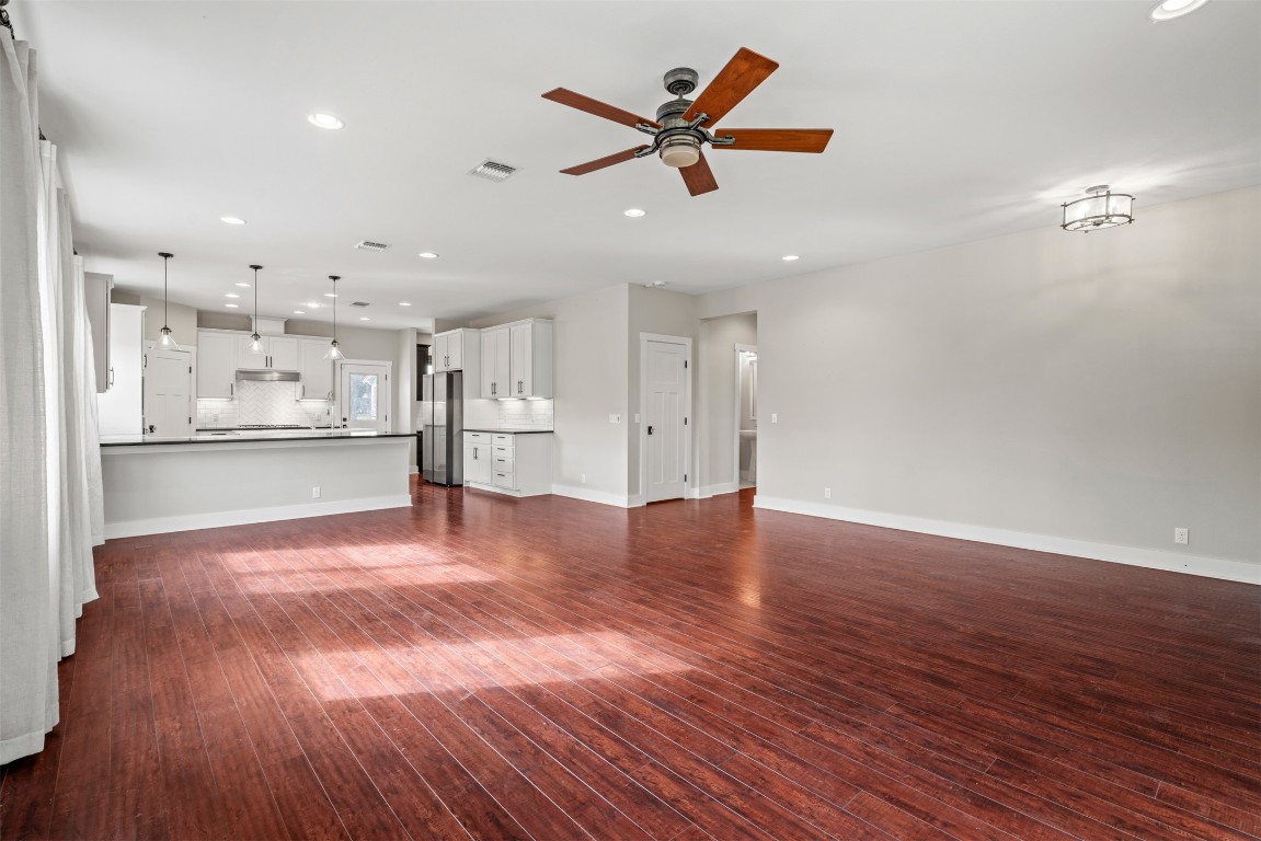 1912 South Church Street Georgetown, TX 78626 - Photo 6 of 40 a view of a kitchen with a dishwasher wooden floor and a refrigerator