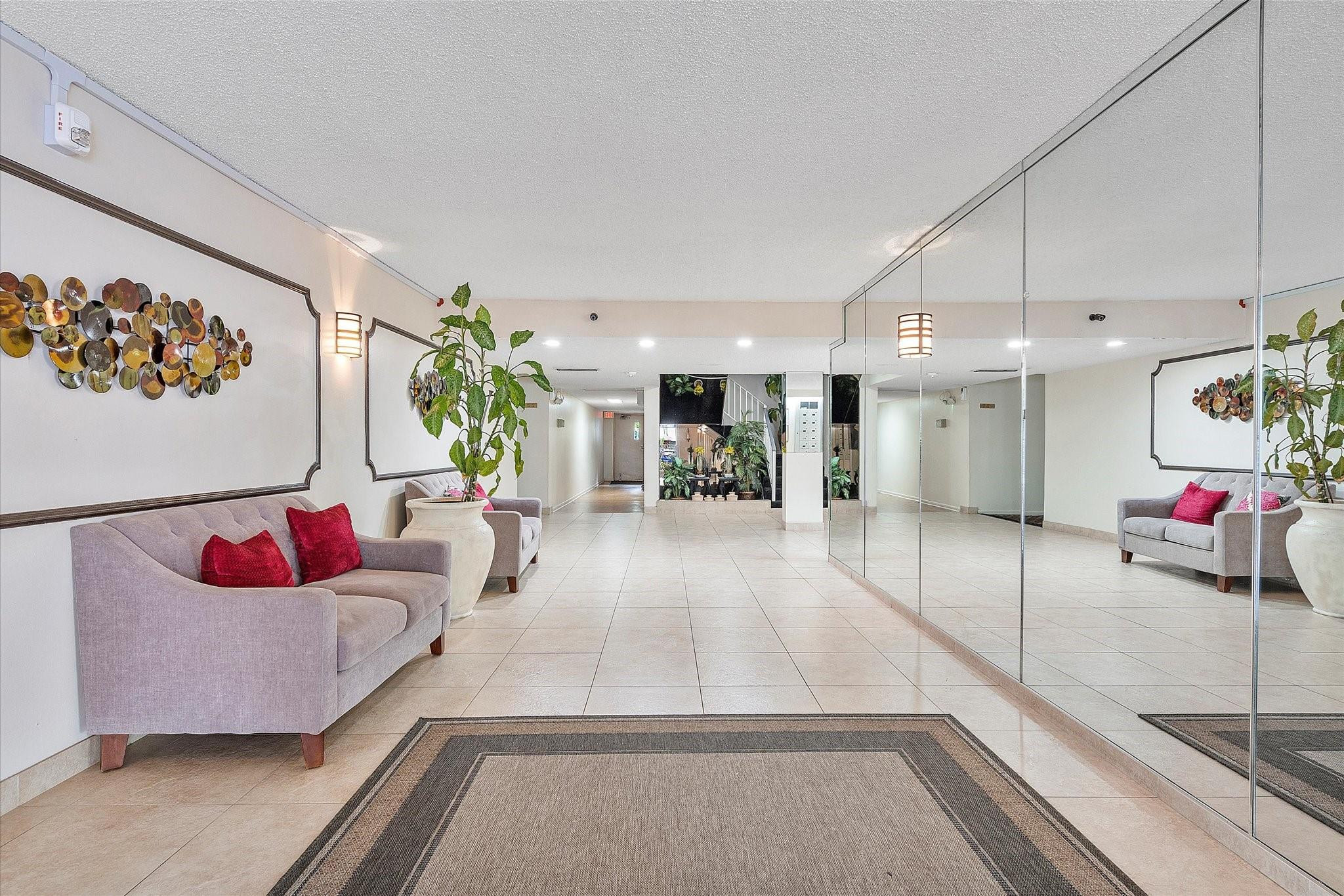 6500 Cypress Road, Unit 211 Plantation, FL 33317 - Photo 11 of 40 a living room with furniture and a couch