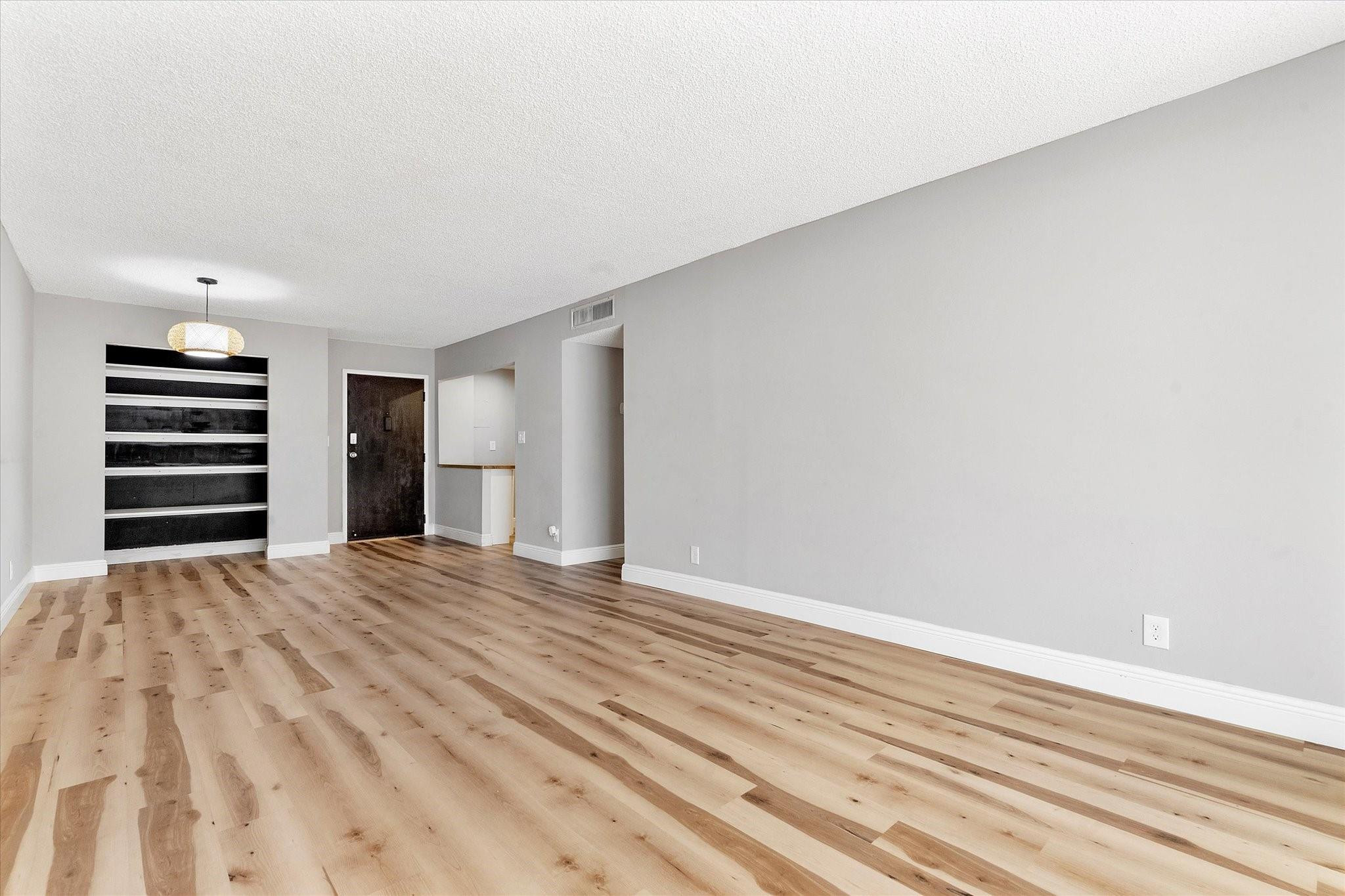 6500 Cypress Road, Unit 211 Plantation, FL 33317 - Photo 15 of 40 a view of empty room with wooden floor and window