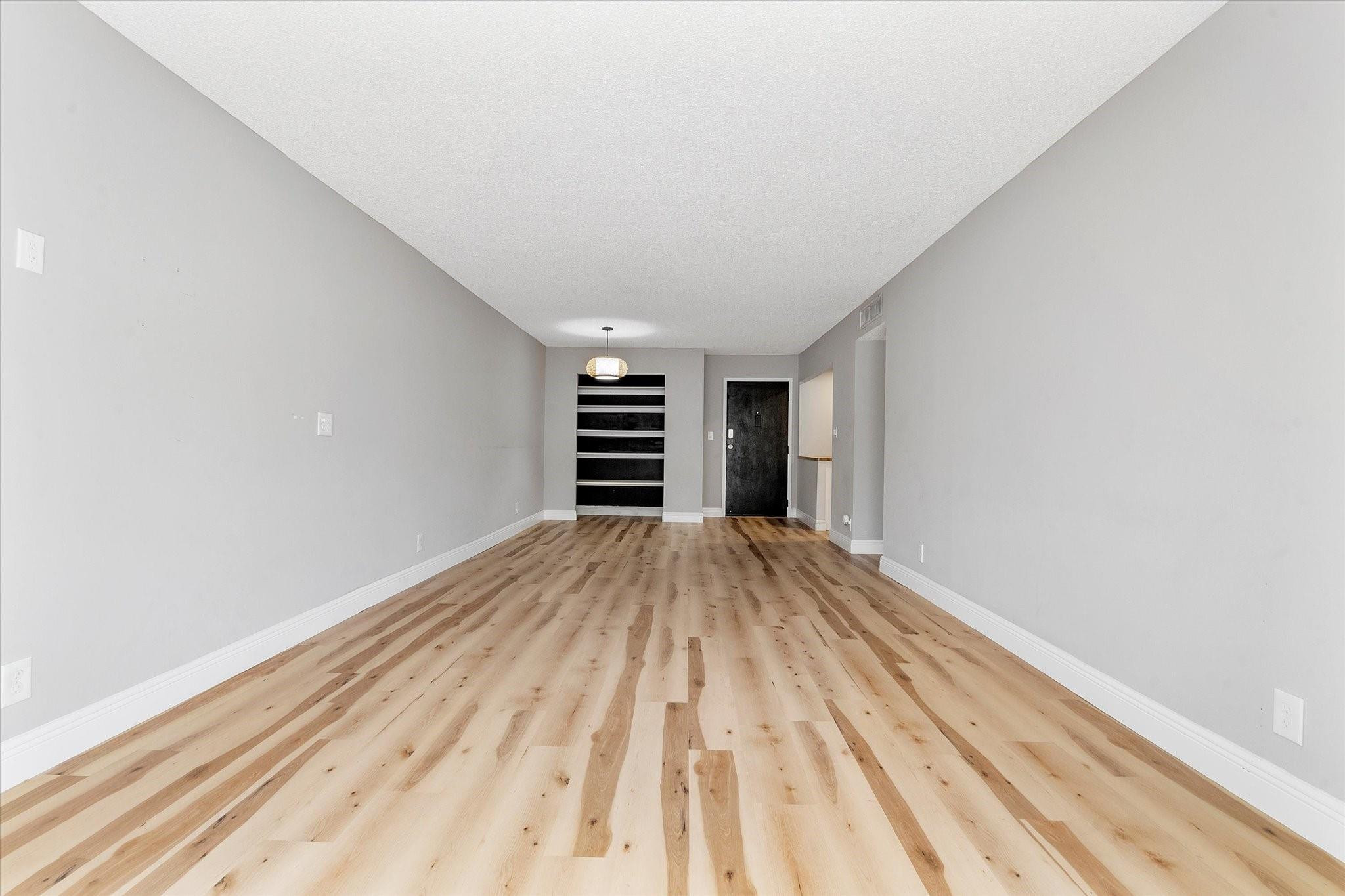 6500 Cypress Road, Unit 211 Plantation, FL 33317 - Photo 16 of 40 a view of empty room with wooden floor