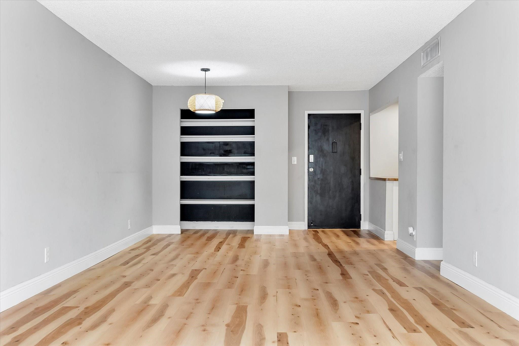 6500 Cypress Road, Unit 211 Plantation, FL 33317 - Photo 17 of 40 a view of a bedroom with wooden floor and closet