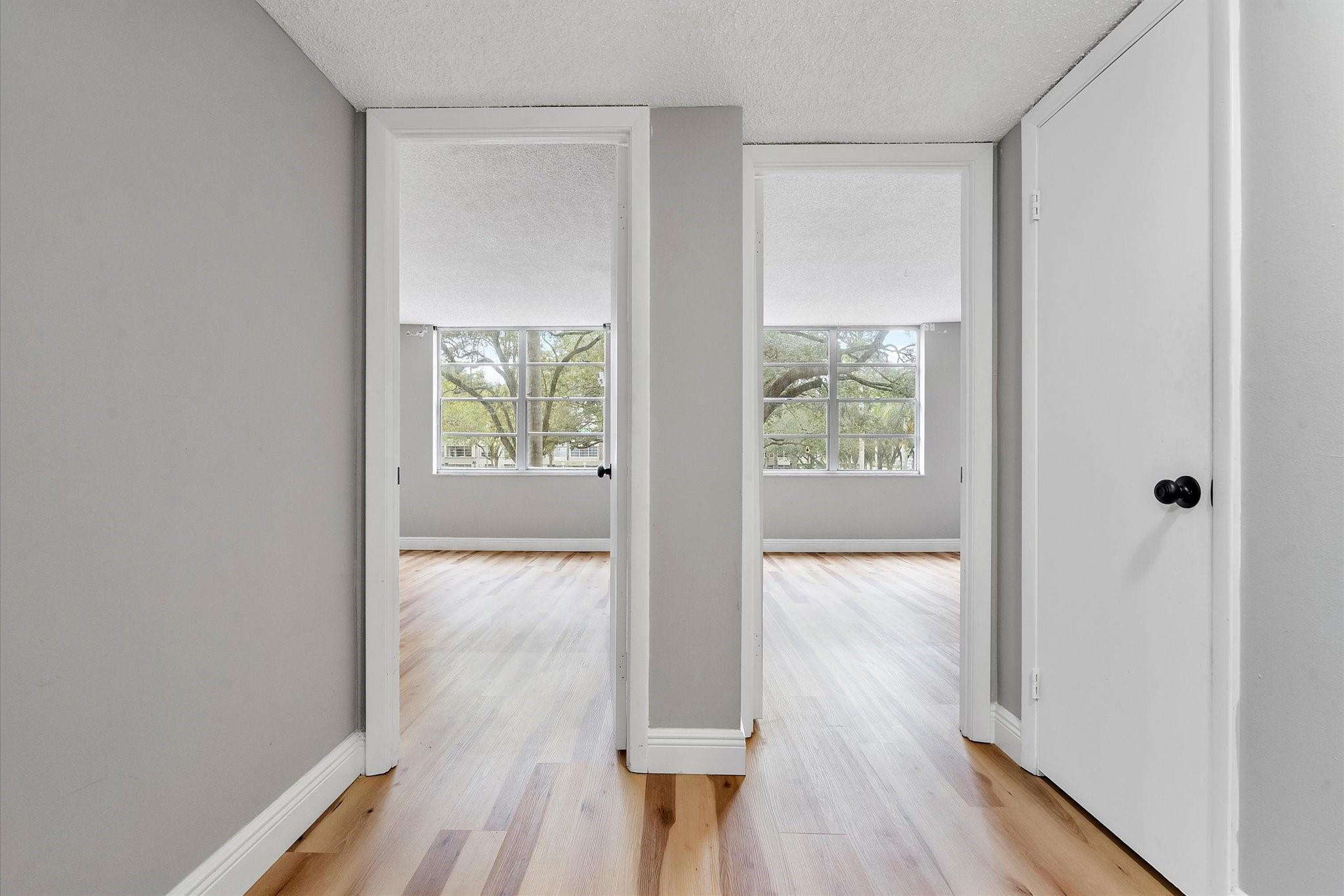 6500 Cypress Road, Unit 211 Plantation, FL 33317 - Photo 20 of 40 a view of hallway with wooden floor
