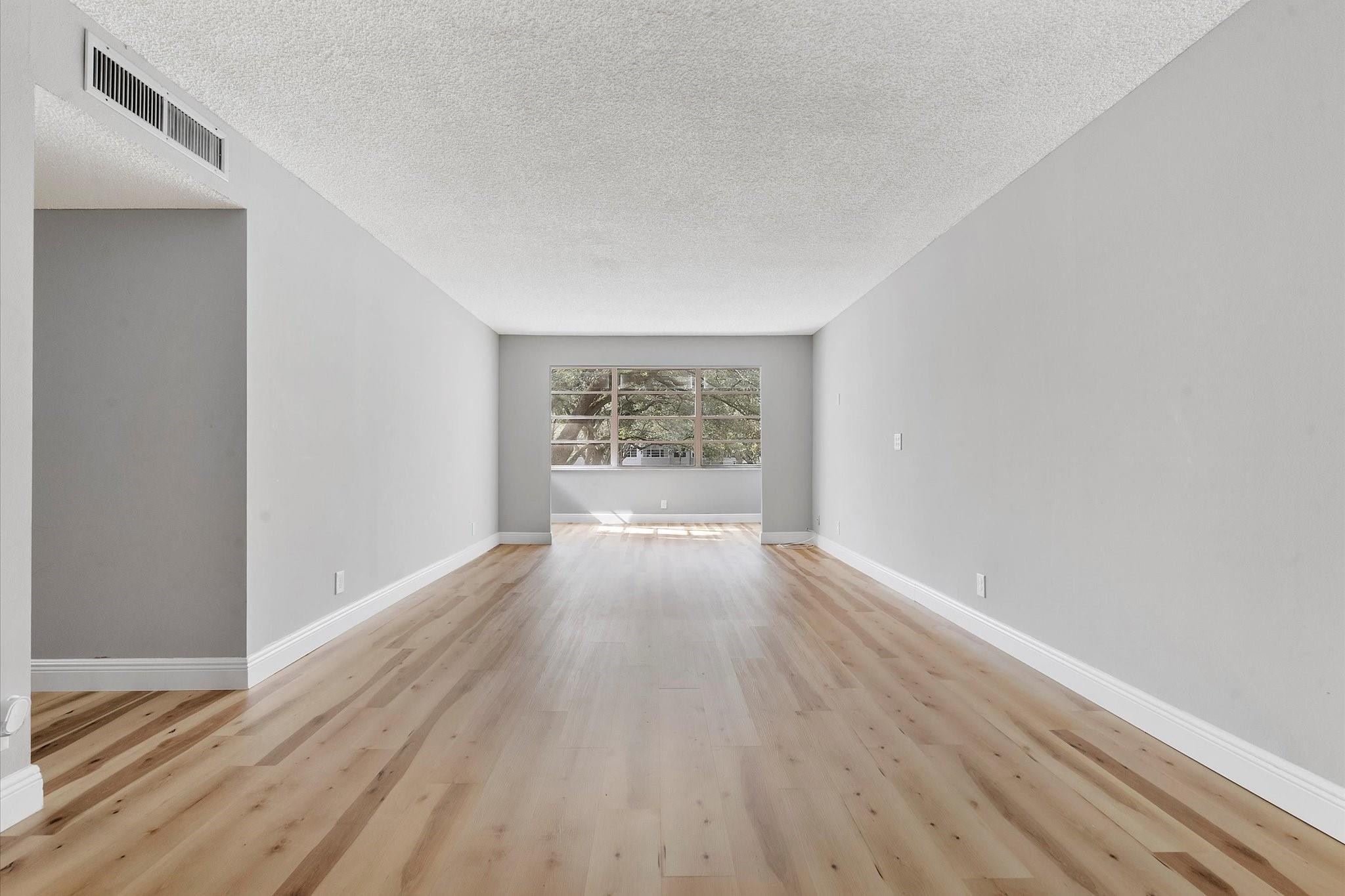 6500 Cypress Road, Unit 211 Plantation, FL 33317 - Photo 2 of 40 a view of an empty room and window