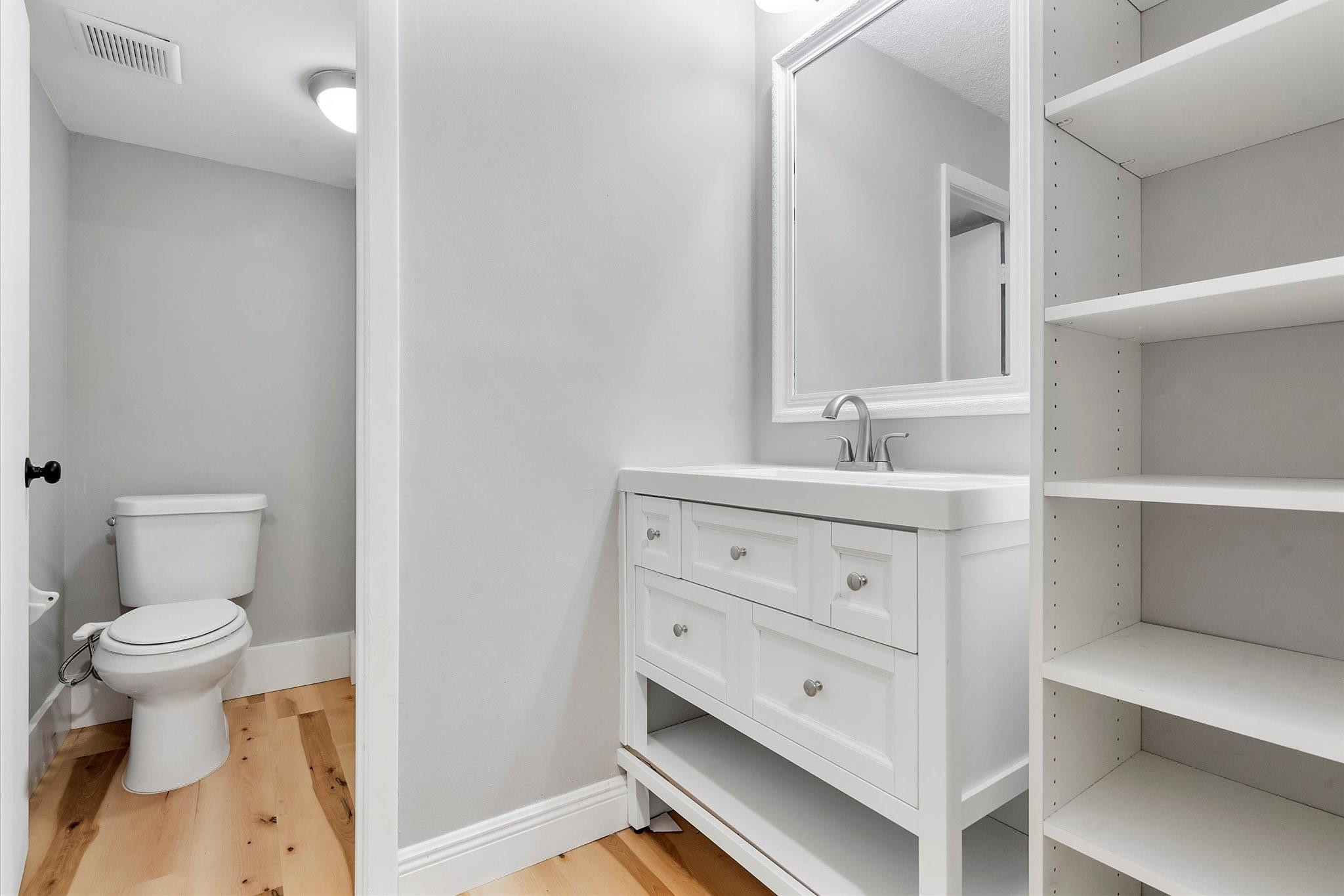 6500 Cypress Road, Unit 211 Plantation, FL 33317 - Photo 25 of 40 a bathroom with a sink toilet vanity and mirror