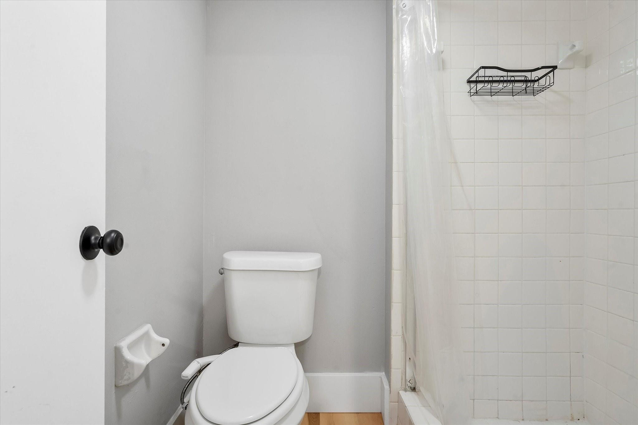 6500 Cypress Road, Unit 211 Plantation, FL 33317 - Photo 26 of 40 a white toilet sitting next to a shower