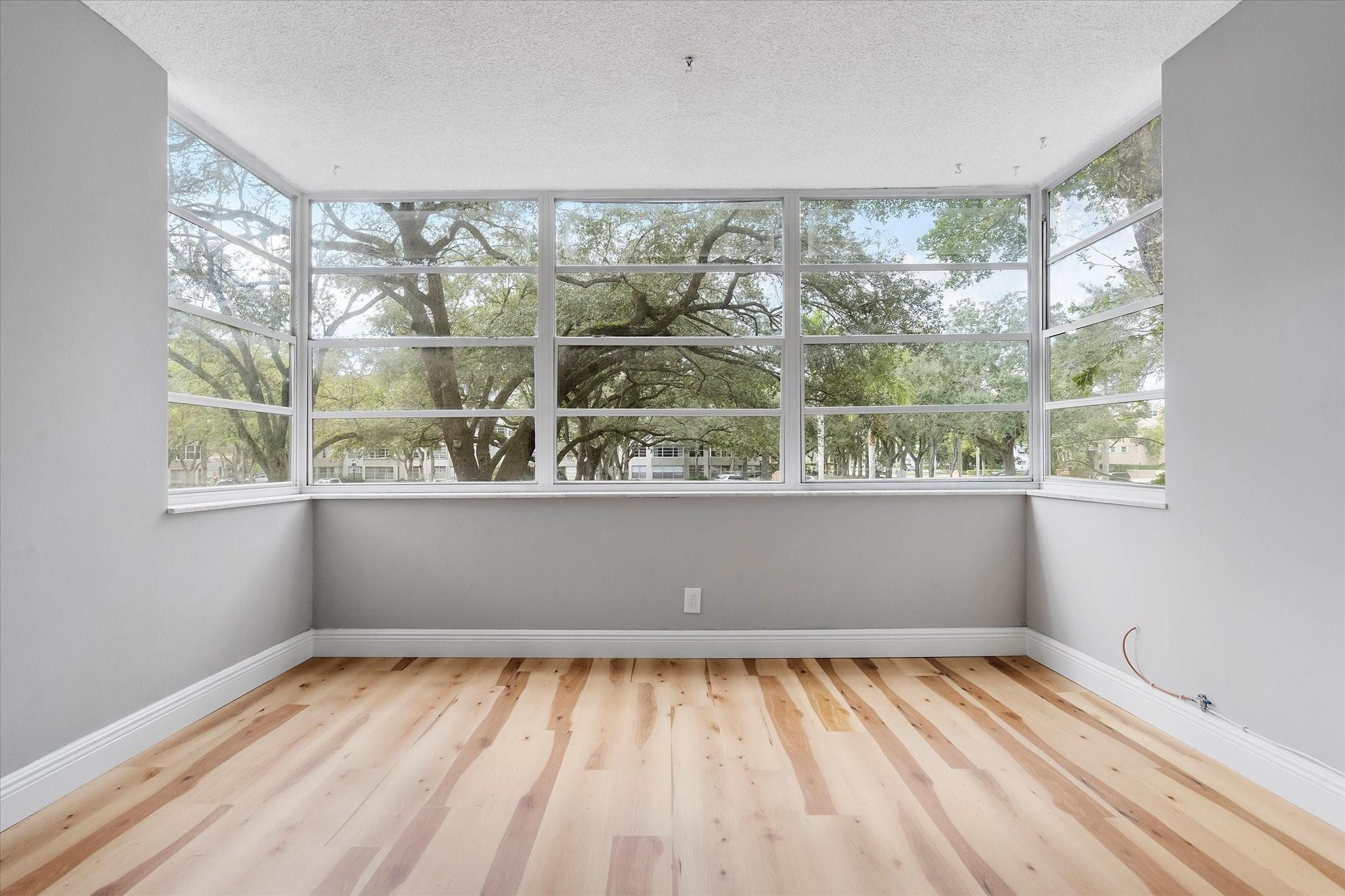 6500 Cypress Road, Unit 211 Plantation, FL 33317 - Photo 3 of 40 a view of a room with wooden floor and a window